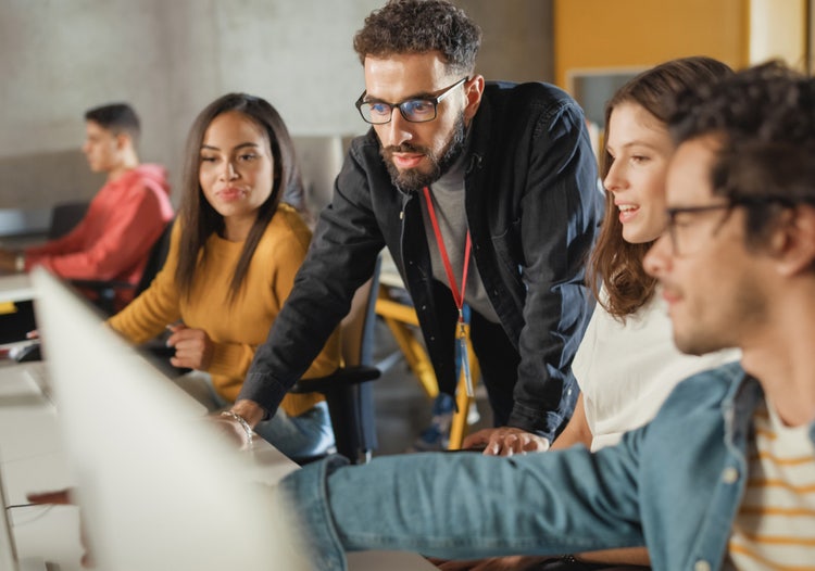 A group of professionals collaborate on a project.