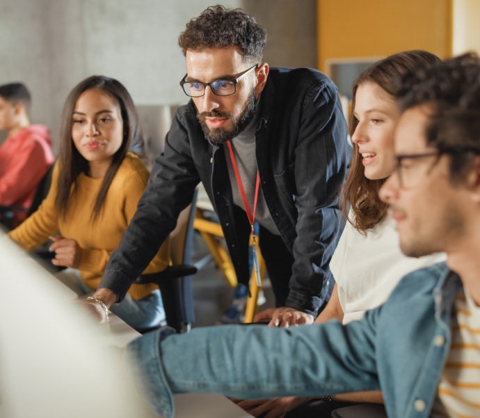 A group of professionals collaborate on a project.
